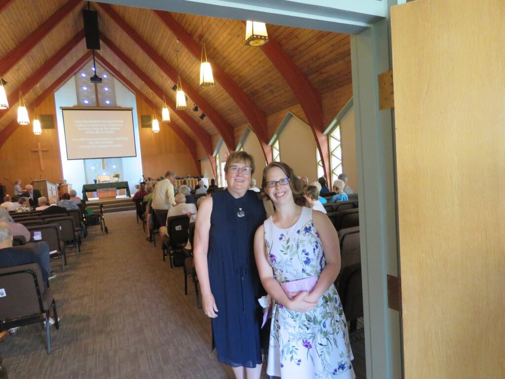 Welcoming visitors to Carman United Church sanctuary