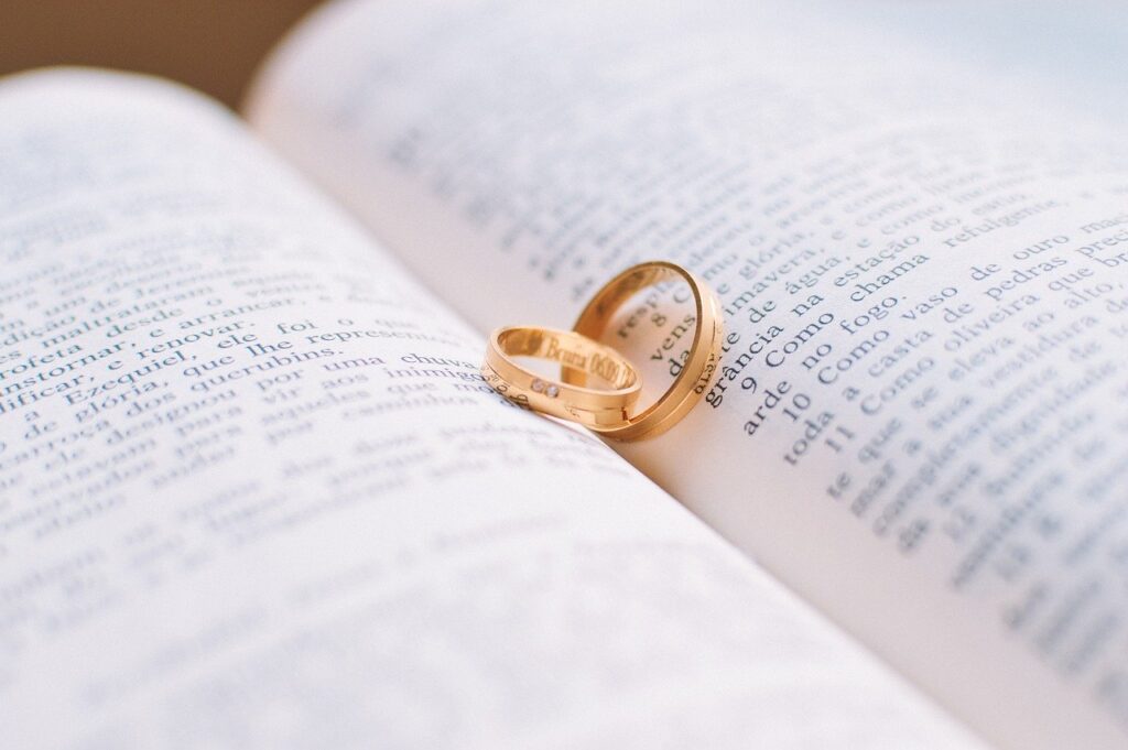 Wedding rings on an open bible